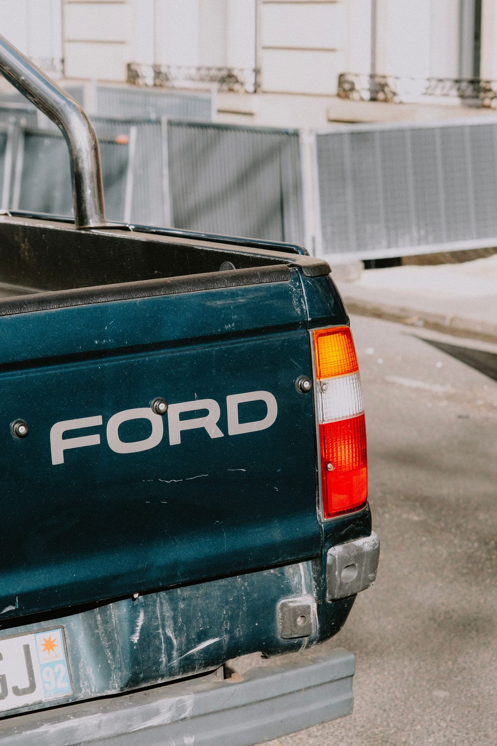 Back glass replacement in Billings: tailgate and rear of a green Ford pickup truck