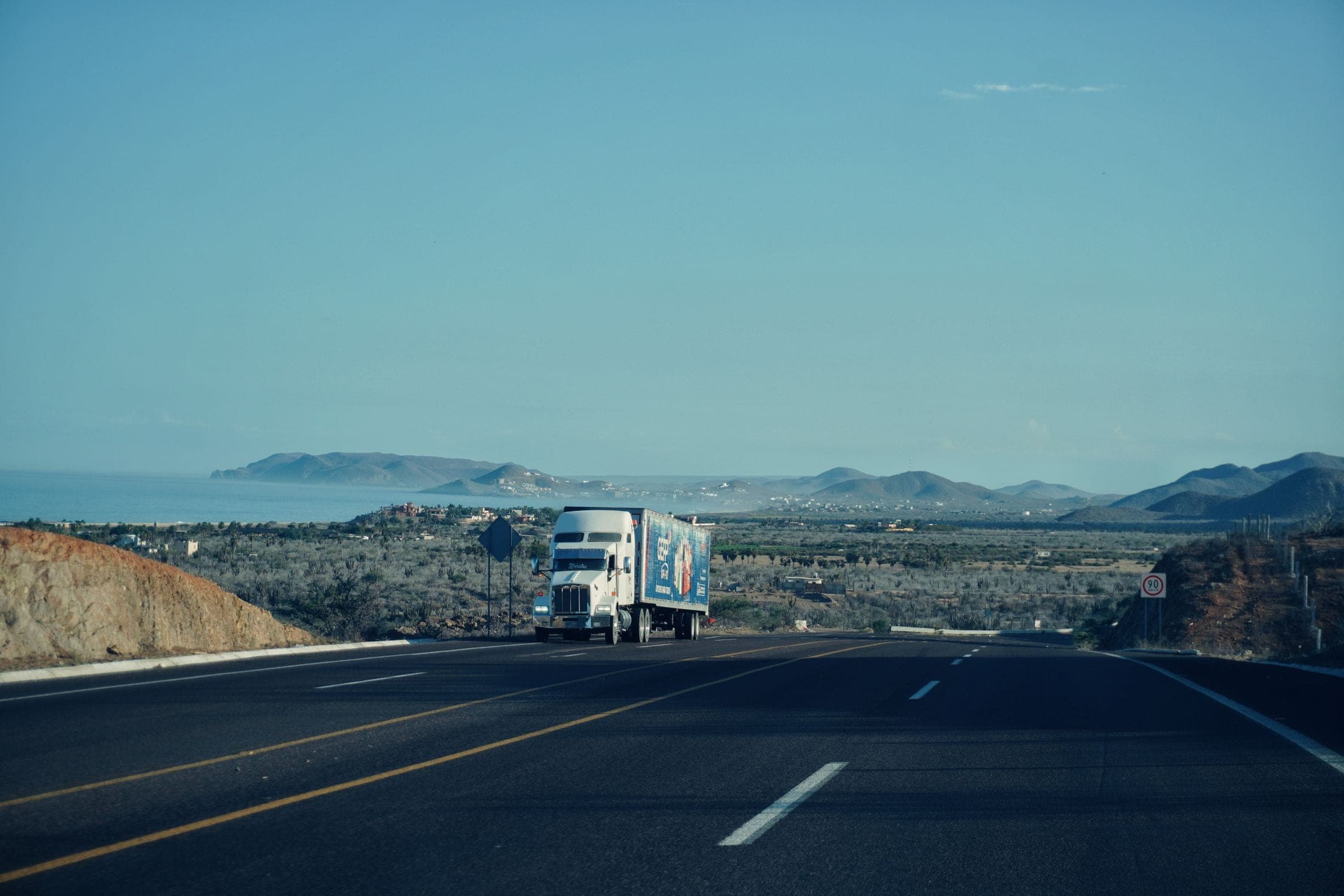 Windshield replacement for Lockwood, MT drivers: semi truck on an interstate highway in open country