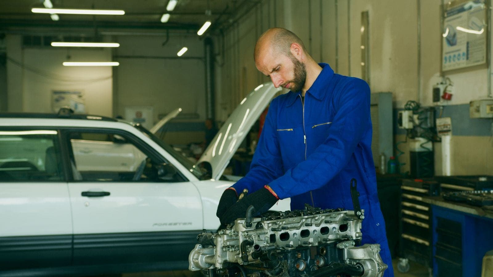 Technician working on a vehicle in the shop