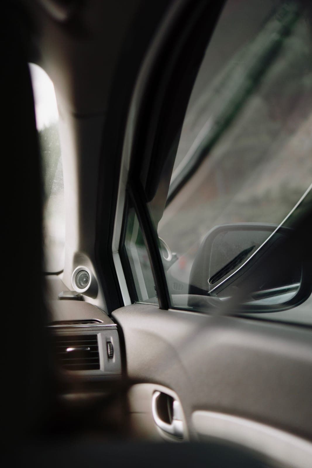 Car door window and side mirror seen from the passenger seat